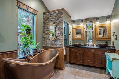 An absolute 3/3/2+ dream home in highly sought after gated on Holly Lake Ranch Golf Club in Texas - for sale on GolfHomes.com, golf home, golf lot