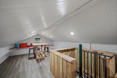 An absolute 3/3/2+ dream home in highly sought after gated on Holly Lake Ranch Golf Club in Texas - for sale on GolfHomes.com, golf home, golf lot