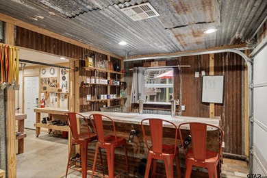 An absolute 3/3/2+ dream home in highly sought after gated on Holly Lake Ranch Golf Club in Texas - for sale on GolfHomes.com, golf home, golf lot