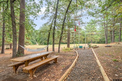 An absolute 3/3/2+ dream home in highly sought after gated on Holly Lake Ranch Golf Club in Texas - for sale on GolfHomes.com, golf home, golf lot