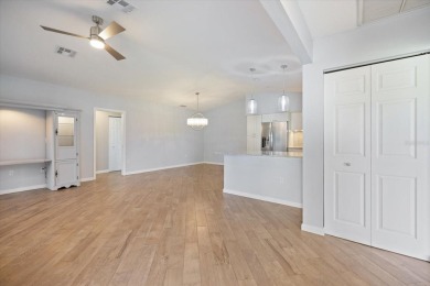 Step inside to discover a masterfully reimagined villa where on IMG Academies Golf and Country Club in Florida - for sale on GolfHomes.com, golf home, golf lot