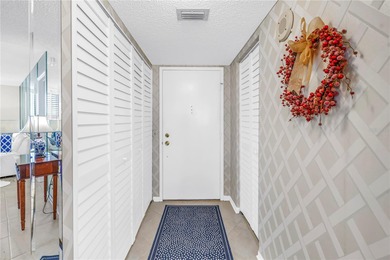 You'll feel instantly at home the moment you step into this on Isla Del Sol Yacht and Country Club in Florida - for sale on GolfHomes.com, golf home, golf lot