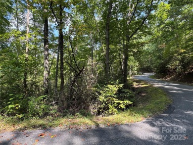 This rare and easily buildable mountain lot sits on the scenic on Rumbling Bald Resort on Lake Lure in North Carolina - for sale on GolfHomes.com, golf home, golf lot