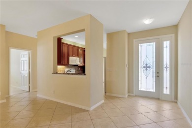 Former Model home.  With a Life in VALENCIA LAKES, one of on Caloosa Greens Executive Golf Course in Florida - for sale on GolfHomes.com, golf home, golf lot