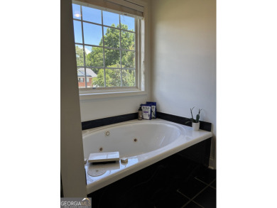 Enjoy life in this beautiful all-brick, low maintenance home in on Jennings Mill Country Club in Georgia - for sale on GolfHomes.com, golf home, golf lot