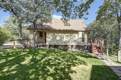 Discover the charm of this unique Ralph Lauren Cottage-inspired on Nocona Hills Golf Course in Texas - for sale on GolfHomes.com, golf home, golf lot