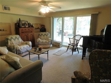 Enjoy golf course living in this spacious 2-story end-unit condo on Lake Forest Golf and Country Club in Missouri - for sale on GolfHomes.com, golf home, golf lot