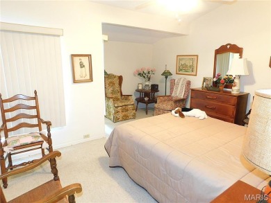 Enjoy golf course living in this spacious 2-story end-unit condo on Lake Forest Golf and Country Club in Missouri - for sale on GolfHomes.com, golf home, golf lot