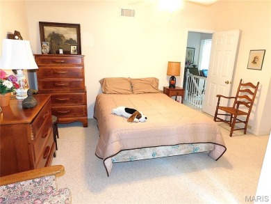 Enjoy golf course living in this spacious 2-story end-unit condo on Lake Forest Golf and Country Club in Missouri - for sale on GolfHomes.com, golf home, golf lot