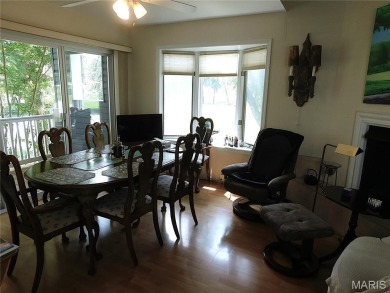 Enjoy golf course living in this spacious 2-story end-unit condo on Lake Forest Golf and Country Club in Missouri - for sale on GolfHomes.com, golf home, golf lot