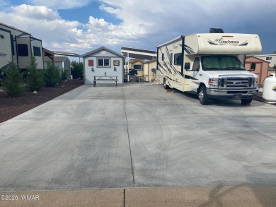 Full concrete slab lot and can accommodate a 42' RV with extra on Juniper Ridge R.V. Golf Resort in Arizona - for sale on GolfHomes.com, golf home, golf lot