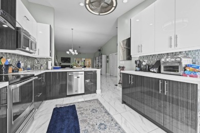 Experience  Florida lifestyle in this beautifully maintained on Deer Creek Golf Club in Florida - for sale on GolfHomes.com, golf home, golf lot
