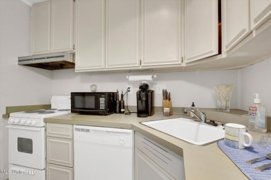 Furnished ready for a new occupant - upper level efficiency on Diamondhead Country Club in Mississippi - for sale on GolfHomes.com, golf home, golf lot