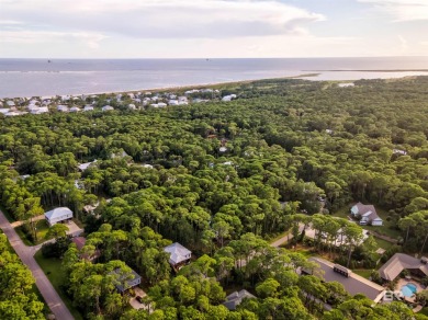 Fall in love with this cozy three bedroom, two bath home tucked on Isle Dauphine Club Golf Course in Alabama - for sale on GolfHomes.com, golf home, golf lot