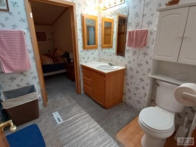 Discover this affordable 3-bedroom gem in the heart of Sugar on Lakeside Golf Course in Michigan - for sale on GolfHomes.com, golf home, golf lot