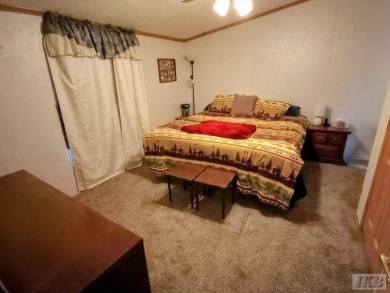 Discover this affordable 3-bedroom gem in the heart of Sugar on Lakeside Golf Course in Michigan - for sale on GolfHomes.com, golf home, golf lot