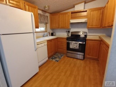 Discover this affordable 3-bedroom gem in the heart of Sugar on Lakeside Golf Course in Michigan - for sale on GolfHomes.com, golf home, golf lot