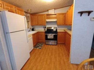 Discover this affordable 3-bedroom gem in the heart of Sugar on Lakeside Golf Course in Michigan - for sale on GolfHomes.com, golf home, golf lot