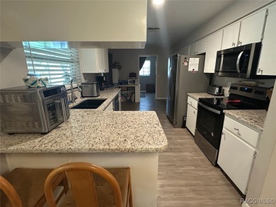Nestled on a spacious, lush lot in the heart of Beverly Hills' on Brentwood Farms Golf Club in Florida - for sale on GolfHomes.com, golf home, golf lot