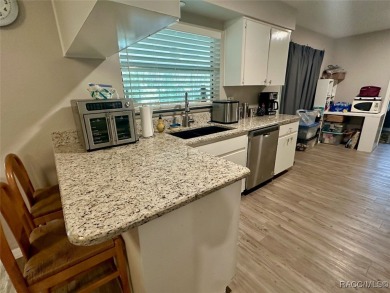 Nestled on a spacious, lush lot in the heart of Beverly Hills' on Brentwood Farms Golf Club in Florida - for sale on GolfHomes.com, golf home, golf lot