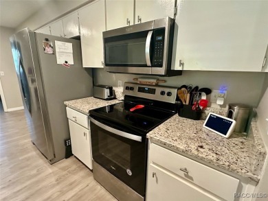 Nestled on a spacious, lush lot in the heart of Beverly Hills' on Brentwood Farms Golf Club in Florida - for sale on GolfHomes.com, golf home, golf lot