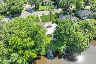 Luxury meets tranquility in this captivating waterfront property on Deal Golf and Country Club in New Jersey - for sale on GolfHomes.com, golf home, golf lot