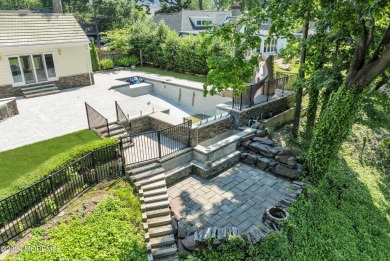 Luxury meets tranquility in this captivating waterfront property on Deal Golf and Country Club in New Jersey - for sale on GolfHomes.com, golf home, golf lot