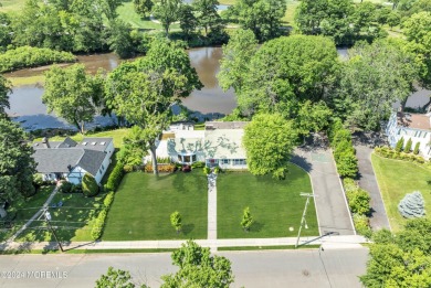 Luxury meets tranquility in this captivating waterfront property on Deal Golf and Country Club in New Jersey - for sale on GolfHomes.com, golf home, golf lot