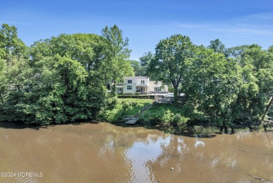 Luxury meets tranquility in this captivating waterfront property on Deal Golf and Country Club in New Jersey - for sale on GolfHomes.com, golf home, golf lot