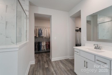 Better than new, this stunning home blends contemporary elegance on Westport Golf Club in North Carolina - for sale on GolfHomes.com, golf home, golf lot