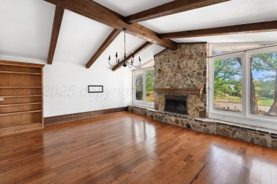 Perched on a scenic hilltop overlooking the lush greens of the on Palo Duro Creek Golf Club in Texas - for sale on GolfHomes.com, golf home, golf lot