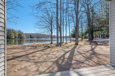 Unbeatable location nestled directly between the tranquil shores on Paupack Hills Golf and Country Club in Pennsylvania - for sale on GolfHomes.com, golf home, golf lot