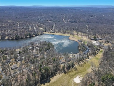 Unbeatable location nestled directly between the tranquil shores on Paupack Hills Golf and Country Club in Pennsylvania - for sale on GolfHomes.com, golf home, golf lot