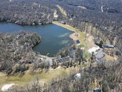 Unbeatable location nestled directly between the tranquil shores on Paupack Hills Golf and Country Club in Pennsylvania - for sale on GolfHomes.com, golf home, golf lot