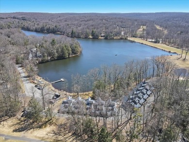 Unbeatable location nestled directly between the tranquil shores on Paupack Hills Golf and Country Club in Pennsylvania - for sale on GolfHomes.com, golf home, golf lot
