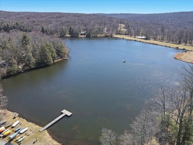 Unbeatable location nestled directly between the tranquil shores on Paupack Hills Golf and Country Club in Pennsylvania - for sale on GolfHomes.com, golf home, golf lot