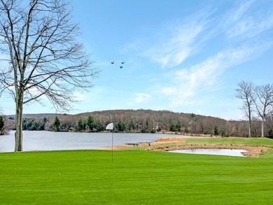 Unbeatable location nestled directly between the tranquil shores on Paupack Hills Golf and Country Club in Pennsylvania - for sale on GolfHomes.com, golf home, golf lot