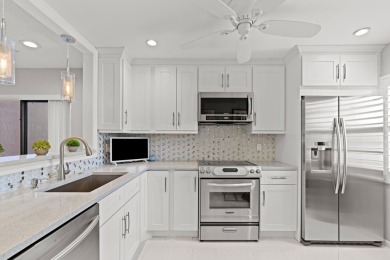 GORGEOUS WATERFRONT CONDO | COMPLETELY REMODELED | FIRST FLOOR on Boca Lago Golf and Country Club in Florida - for sale on GolfHomes.com, golf home, golf lot