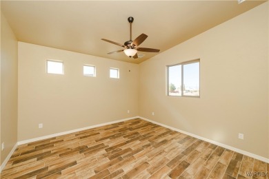 Nestled within the serene landscape of a golf course subdivision on Valle Vista Golf Course in Arizona - for sale on GolfHomes.com, golf home, golf lot