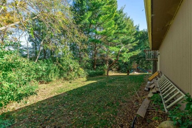 This spacious quad-level home is nestled on a double wooded lot on Savannah Oaks Golf Club of Candlewick Lake in Illinois - for sale on GolfHomes.com, golf home, golf lot