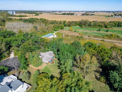 This spacious quad-level home is nestled on a double wooded lot on Savannah Oaks Golf Club of Candlewick Lake in Illinois - for sale on GolfHomes.com, golf home, golf lot