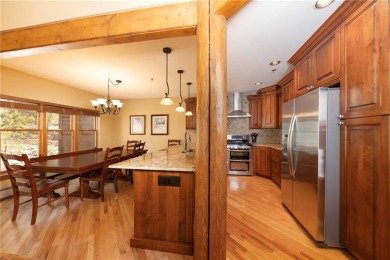 Rare 4-bedroom end unit townhome with warm wood accents and a on The River Course At Keystone in Colorado - for sale on GolfHomes.com, golf home, golf lot