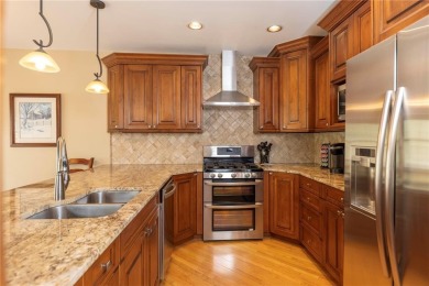 Rare 4-bedroom end unit townhome with warm wood accents and a on The River Course At Keystone in Colorado - for sale on GolfHomes.com, golf home, golf lot