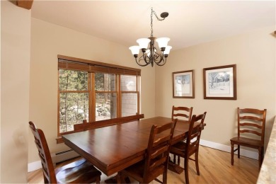 Rare 4-bedroom end unit townhome with warm wood accents and a on The River Course At Keystone in Colorado - for sale on GolfHomes.com, golf home, golf lot