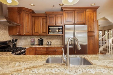 Rare 4-bedroom end unit townhome with warm wood accents and a on The River Course At Keystone in Colorado - for sale on GolfHomes.com, golf home, golf lot