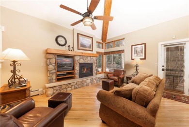 Rare 4-bedroom end unit townhome with warm wood accents and a on The River Course At Keystone in Colorado - for sale on GolfHomes.com, golf home, golf lot