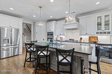 Located on a private lot backing to a serene, wooded preserve on Cape Fear National At Brunswick Forest in North Carolina - for sale on GolfHomes.com, golf home, golf lot