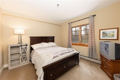 Rare 4-bedroom end unit townhome with warm wood accents and a on The River Course At Keystone in Colorado - for sale on GolfHomes.com, golf home, golf lot