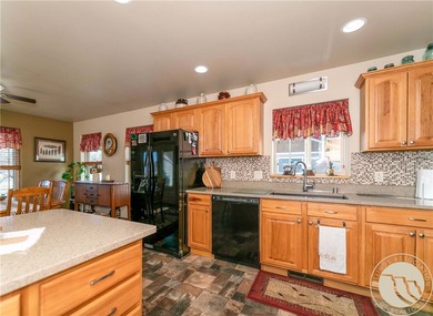 Beautifully maintained 5-bedroom, 3-bath home backing to Lake on Lake Hills Golf Course in Montana - for sale on GolfHomes.com, golf home, golf lot