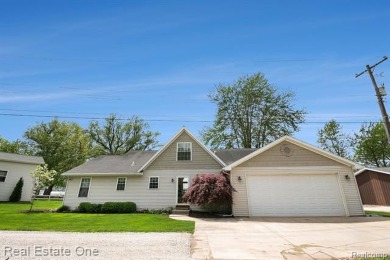 Welcome to 1171 North Shore, an exceptional waterfront property on Duck Lake Country Club in Michigan - for sale on GolfHomes.com, golf home, golf lot